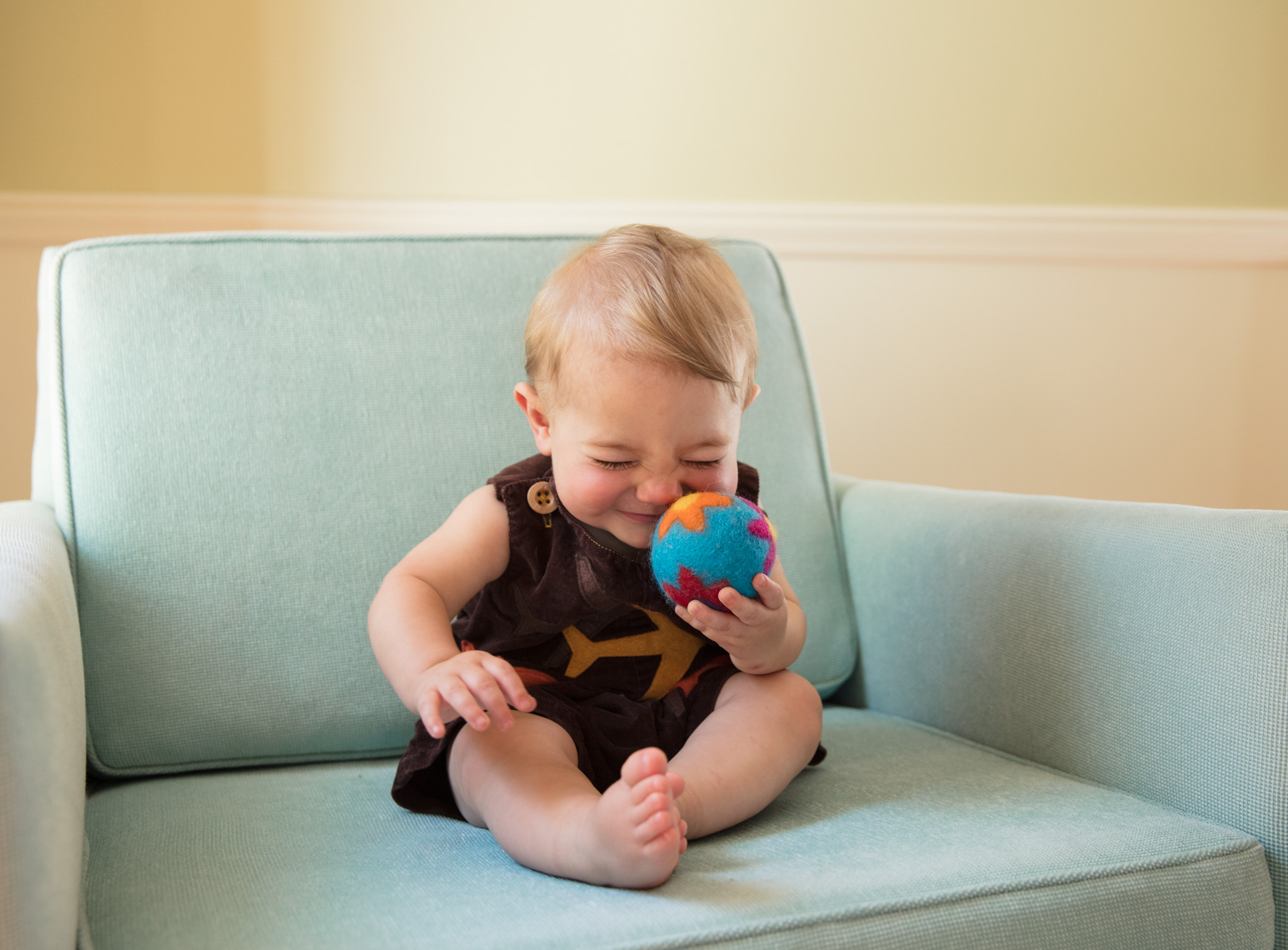 Jolly baby playing ball | Kids Lifestyle Photographer