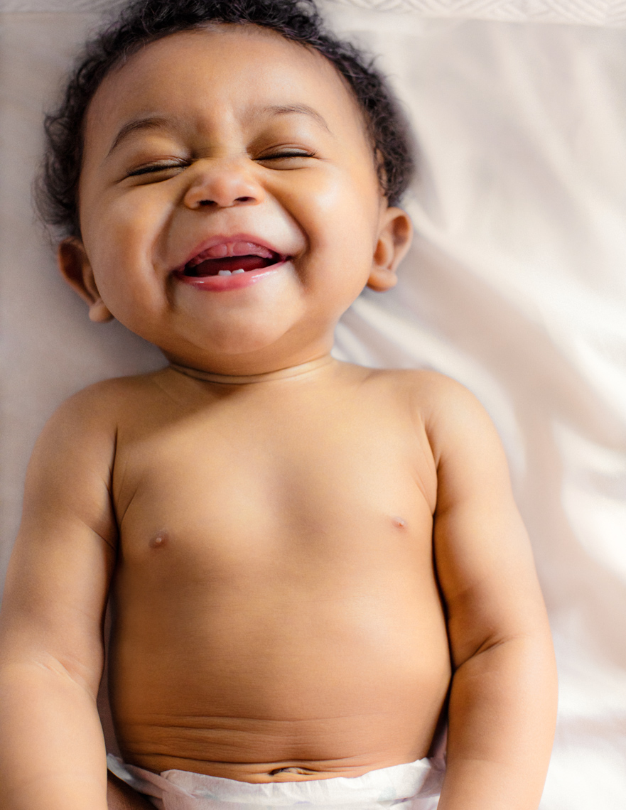 Joyful baby laughing | Commercial Lifestyle Photographer