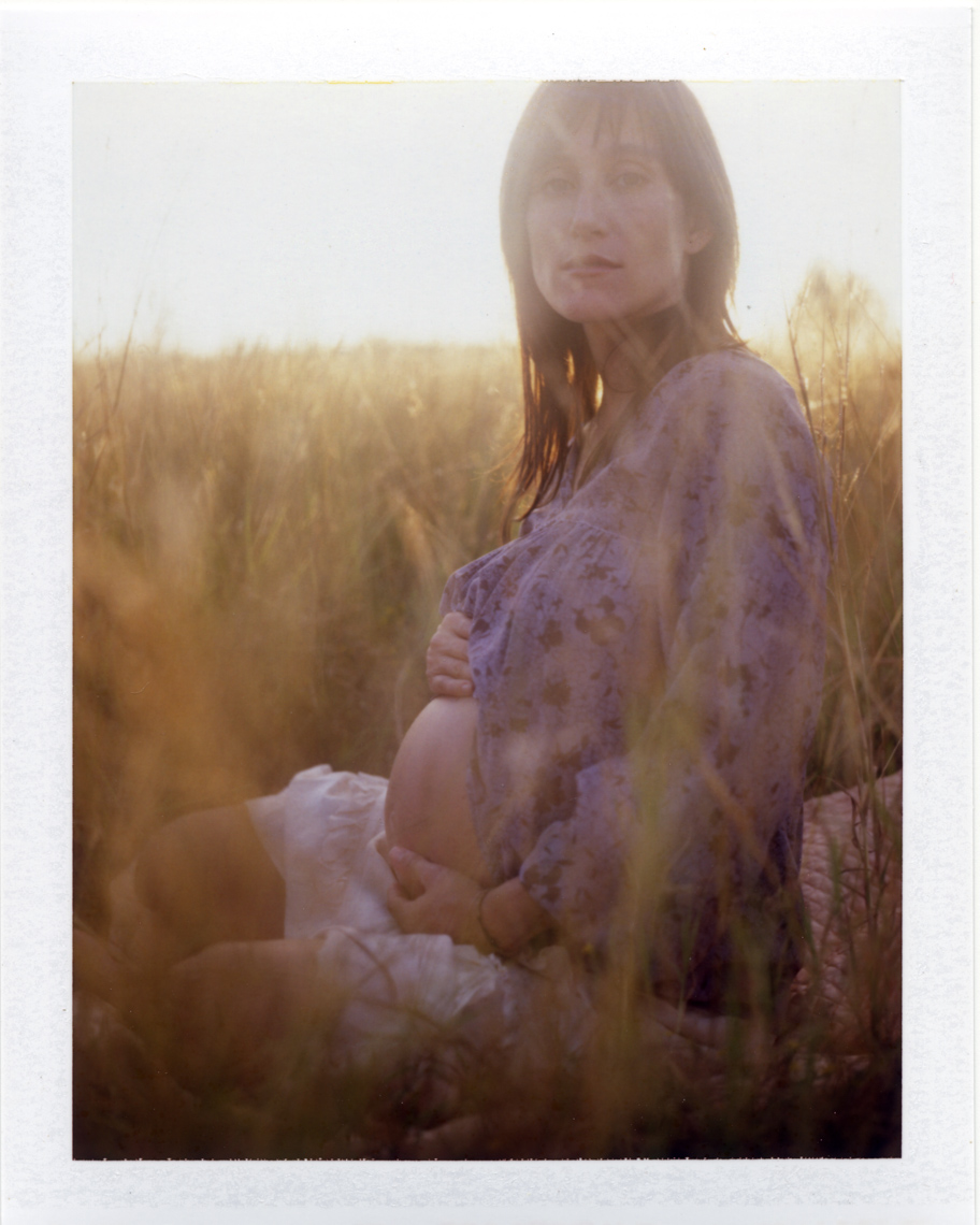 Alluring pregnant woman | Polaroid Photographers