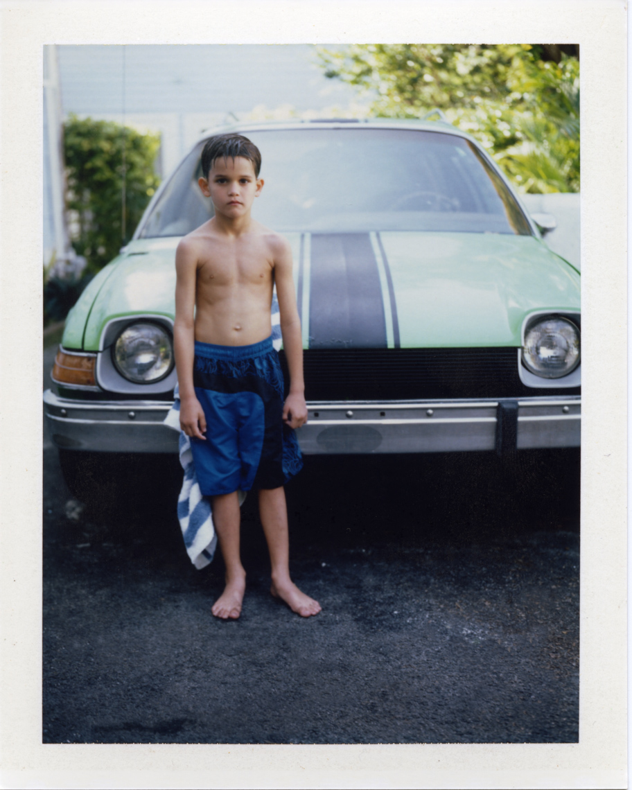 Boy with vintage car | Photographer using Polaroid