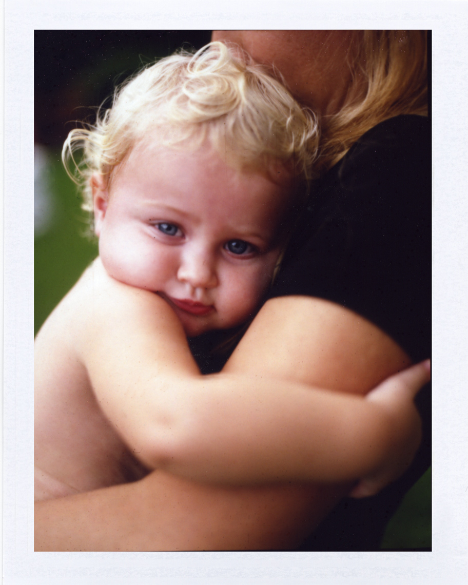 Baby hugging mom | Photographers who shoot film
