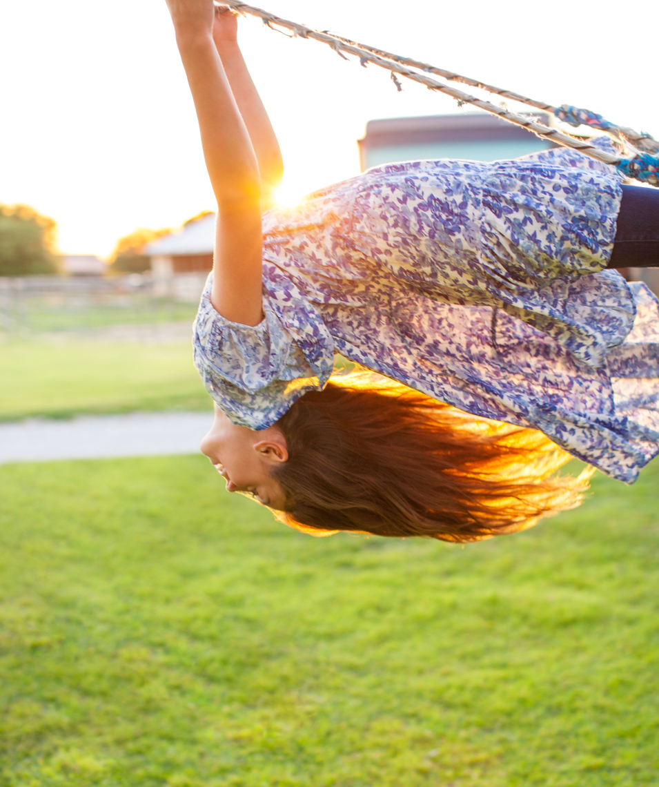 Girl bending backwards on swing   | Teen Lifestyle Photographer