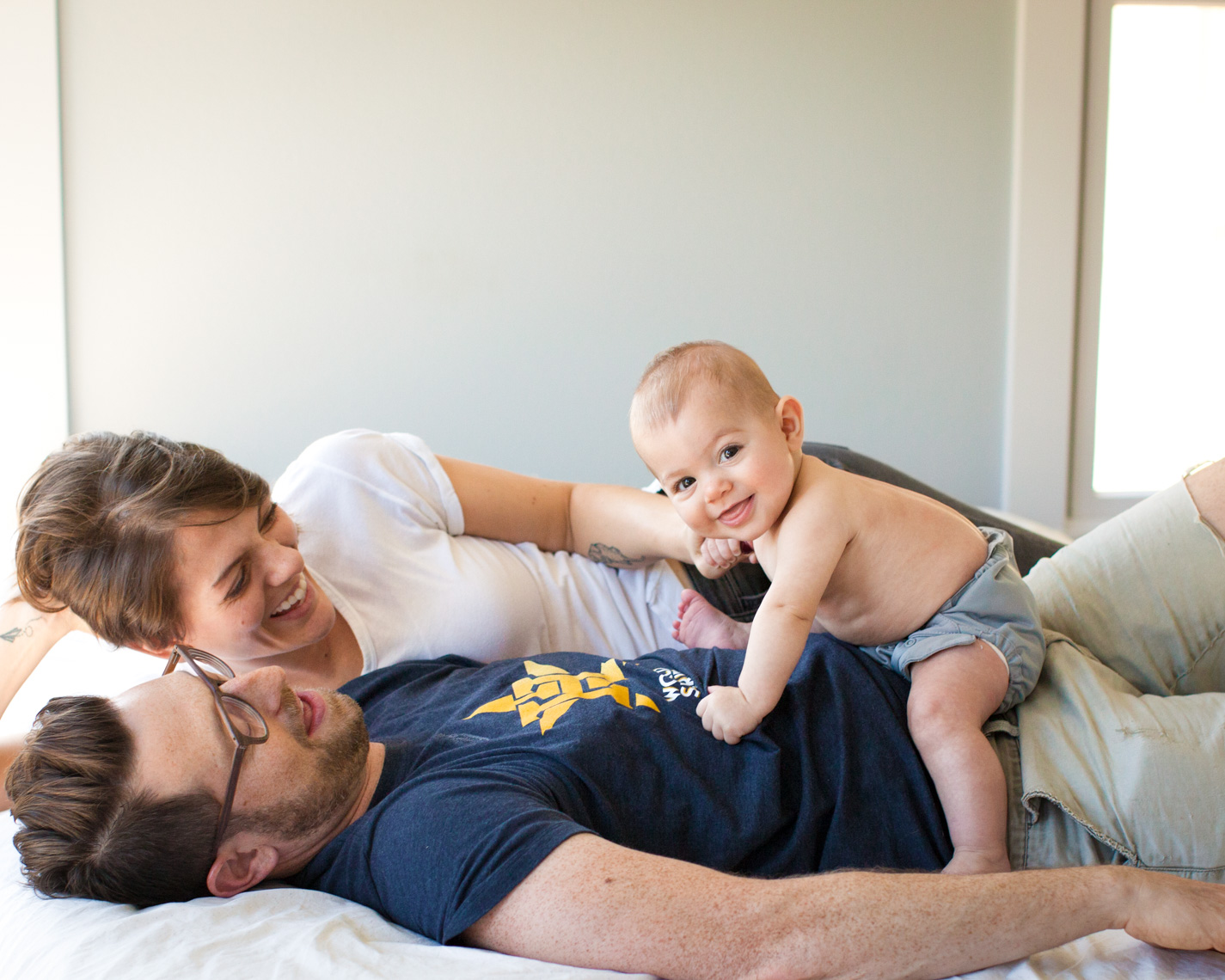 Playful parents with baby | Commercial Lifestyle Photographer