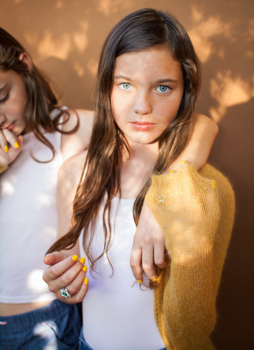 Twins sharing yellow sweater | Editorial Portrait Photographer