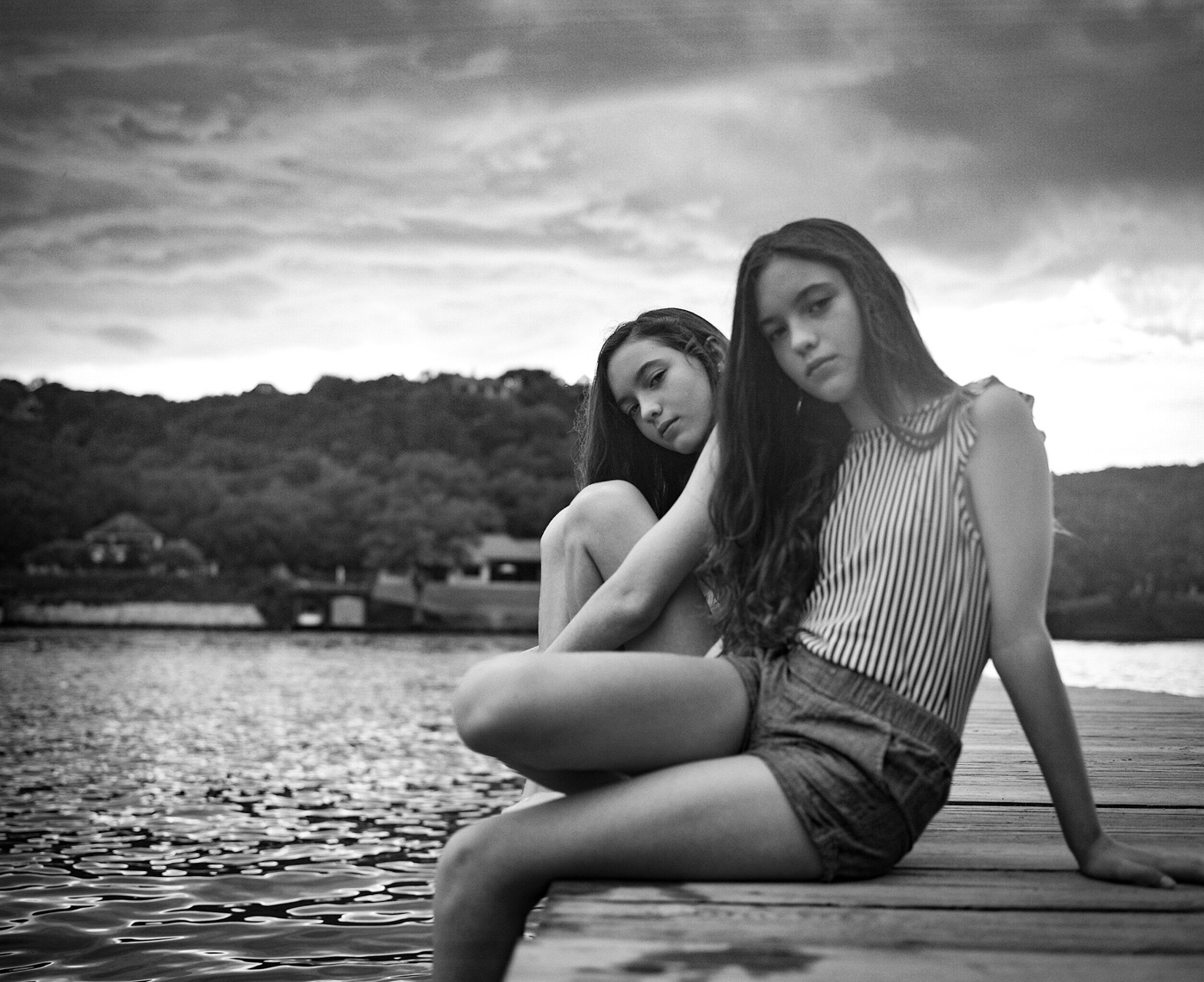 Graceful girls sitting on dock  | Tosca Radigonda Photography 