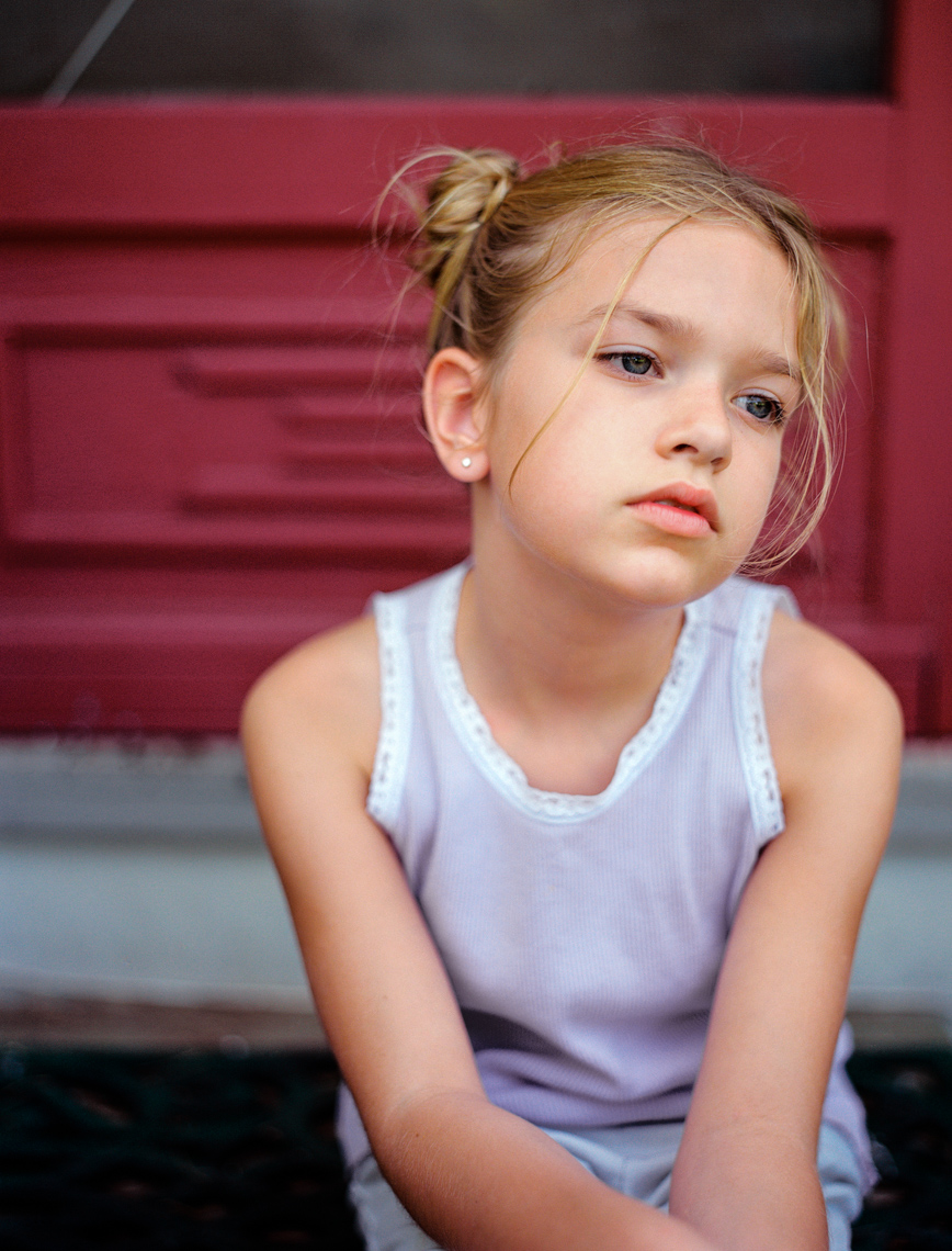 Child sitting on porch | Creative Portrait Photographer