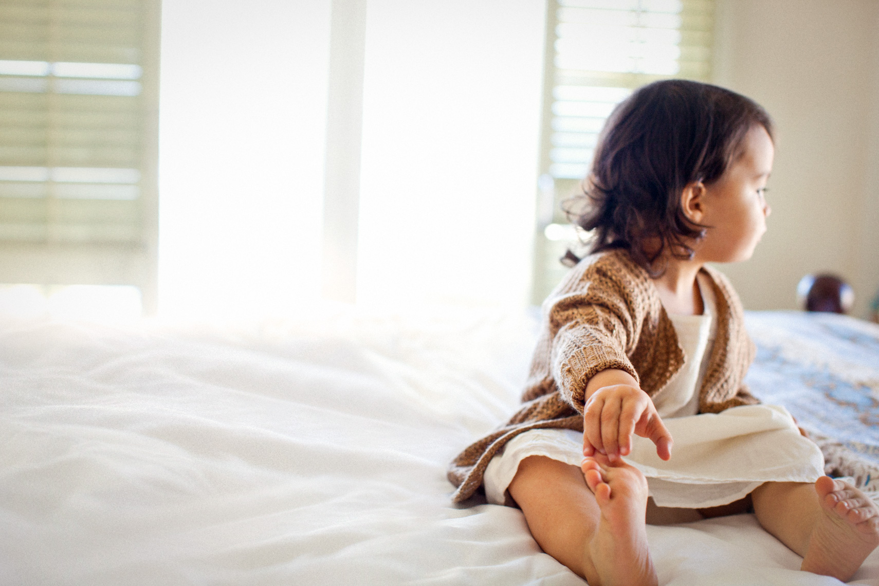 Child  grabbing her toes | Kids Lifestyle Photographer