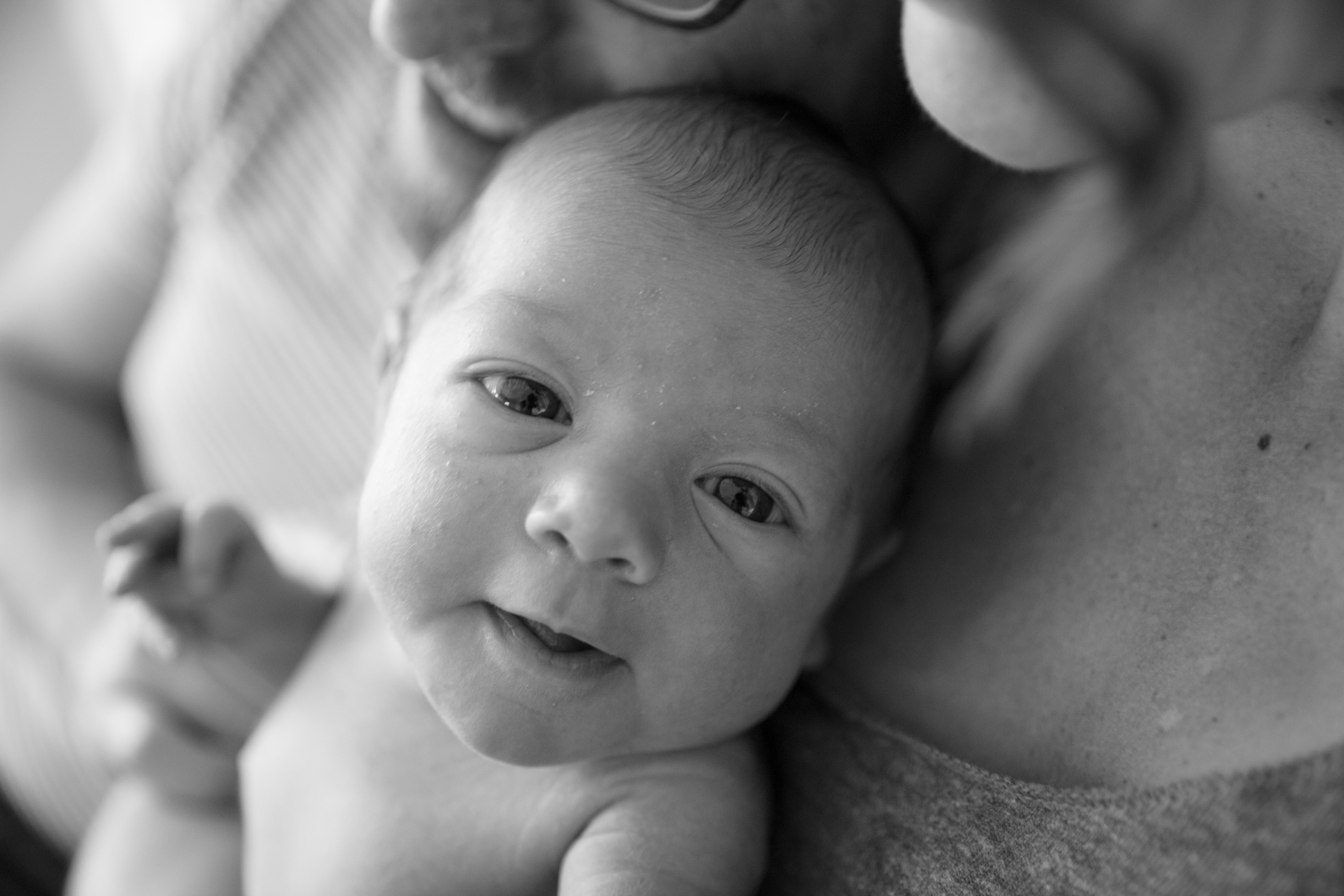 Newborn smiling into camera  | Visual Storytelling Photographer