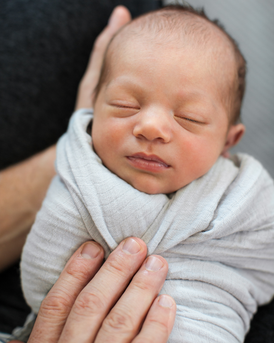 Sleeping newborn swaddled | Visual Storytelling Photographer