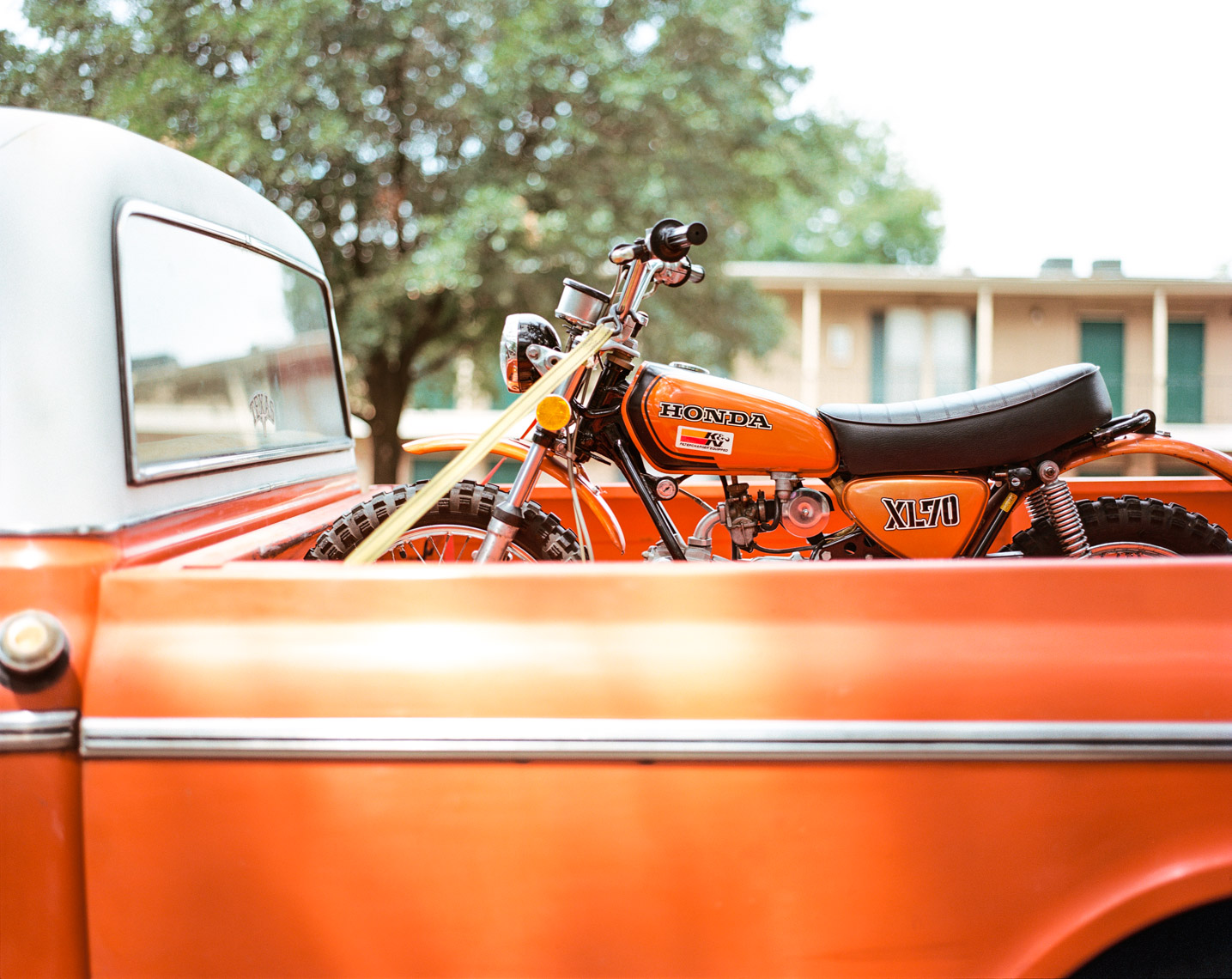 Vintage truck carrying dirtbike | Editorial Lifestyle Photographer