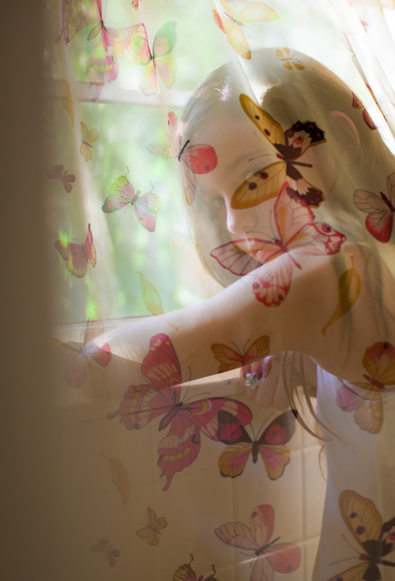 Girl behind butterfly curtain | Editorial Portrait Photographer