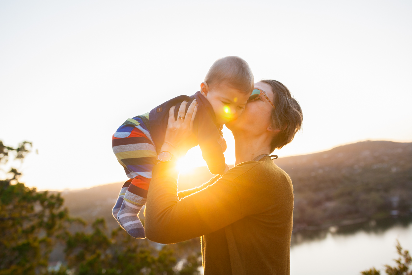 Mom kissing baby at sunset | Commercial Lifestyle Photographer