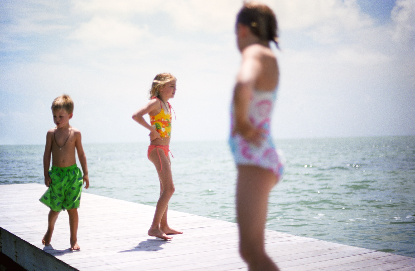 Kids standing on dock | Tosca Radigonda Photography