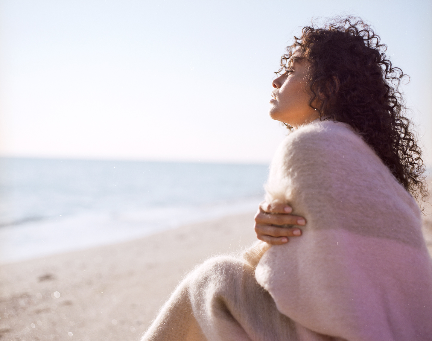 Graceful woman watching ocean waves| Beauty Editorial Photographer