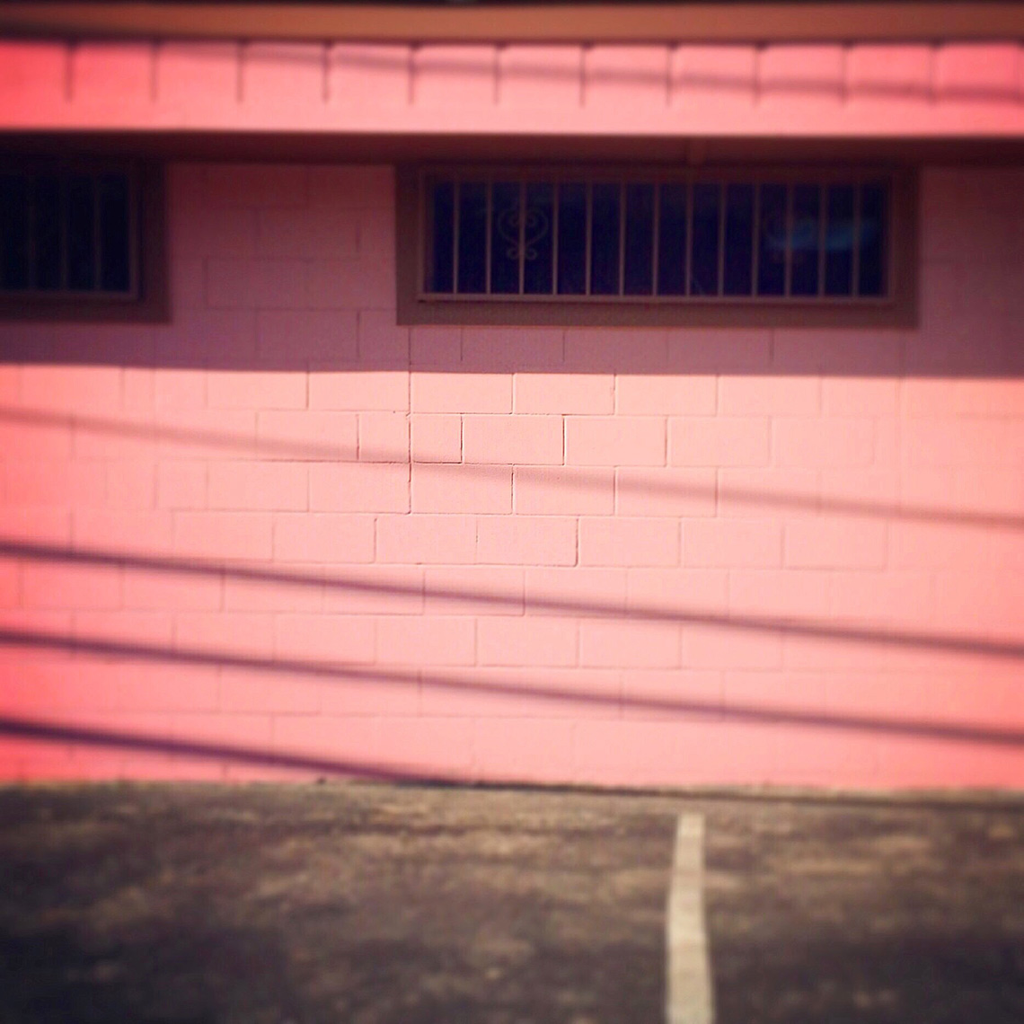 Bright pink building shadow lines | Visual Storytelling Photographer